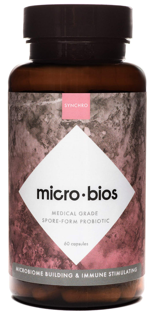 Synchro MicroBios bottle close-up showing capsules for immune and gut health support.