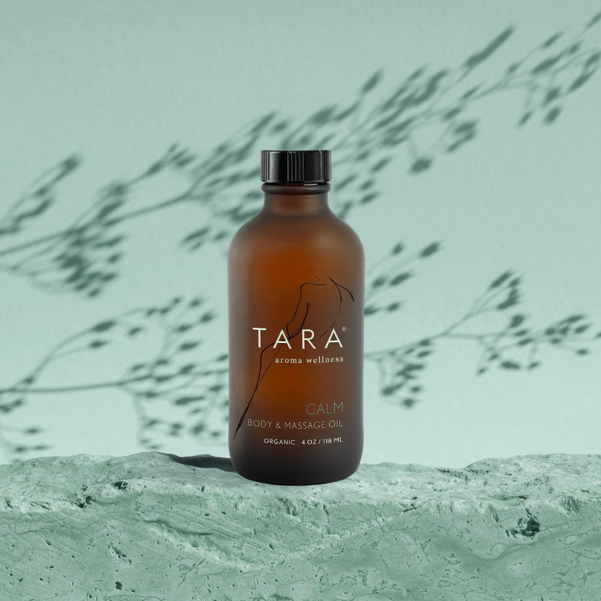 TARA Spa Therapy Calm bottle placed on towel for home spa ritual.