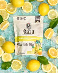 Taste Salud on-the-go stick pack next to a water bottle for travel hydration.