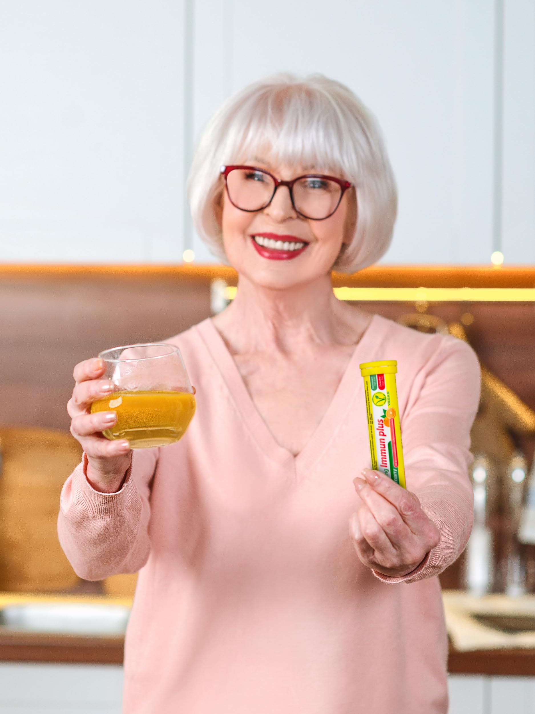 Glass of water with Oxi C tablet fizzing for a refreshing citrus drink
