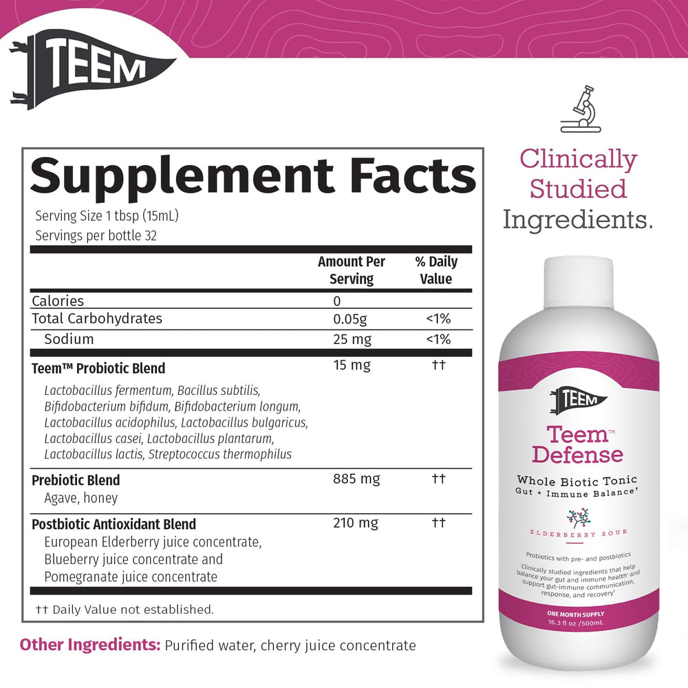Teem Defense elderberry probiotic tonic in a glass for sipping