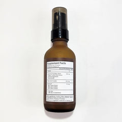 Terra Health Essentials liposomal curcumin drops dispense into glass for quick mixing