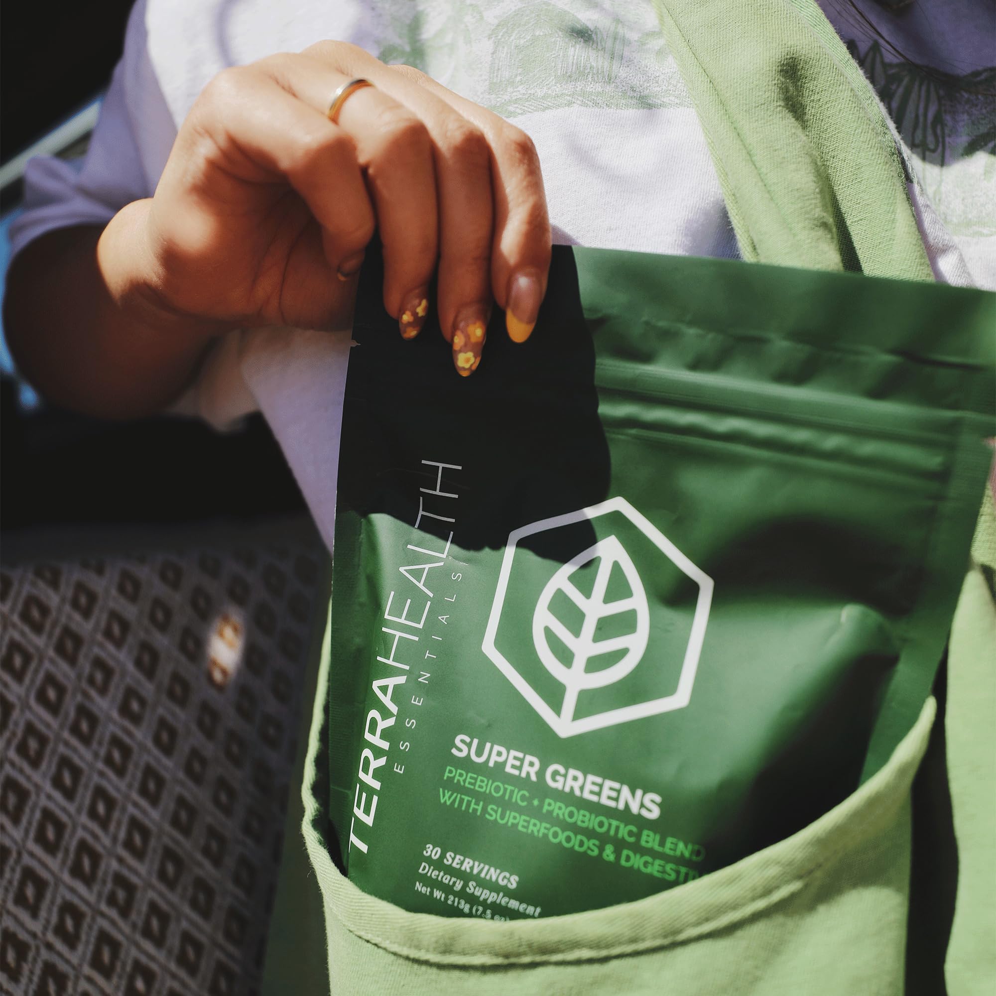 Terra Health Essentials Super Greens label close-up showing glyphosate-free and allergen-friendly formula.