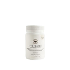 The Beauty Chef Gut Primer bottle being poured for daily gut support
