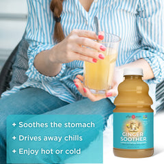 Close-up of fresh ginger and lemon on The Ginger People Gingerade bottle.