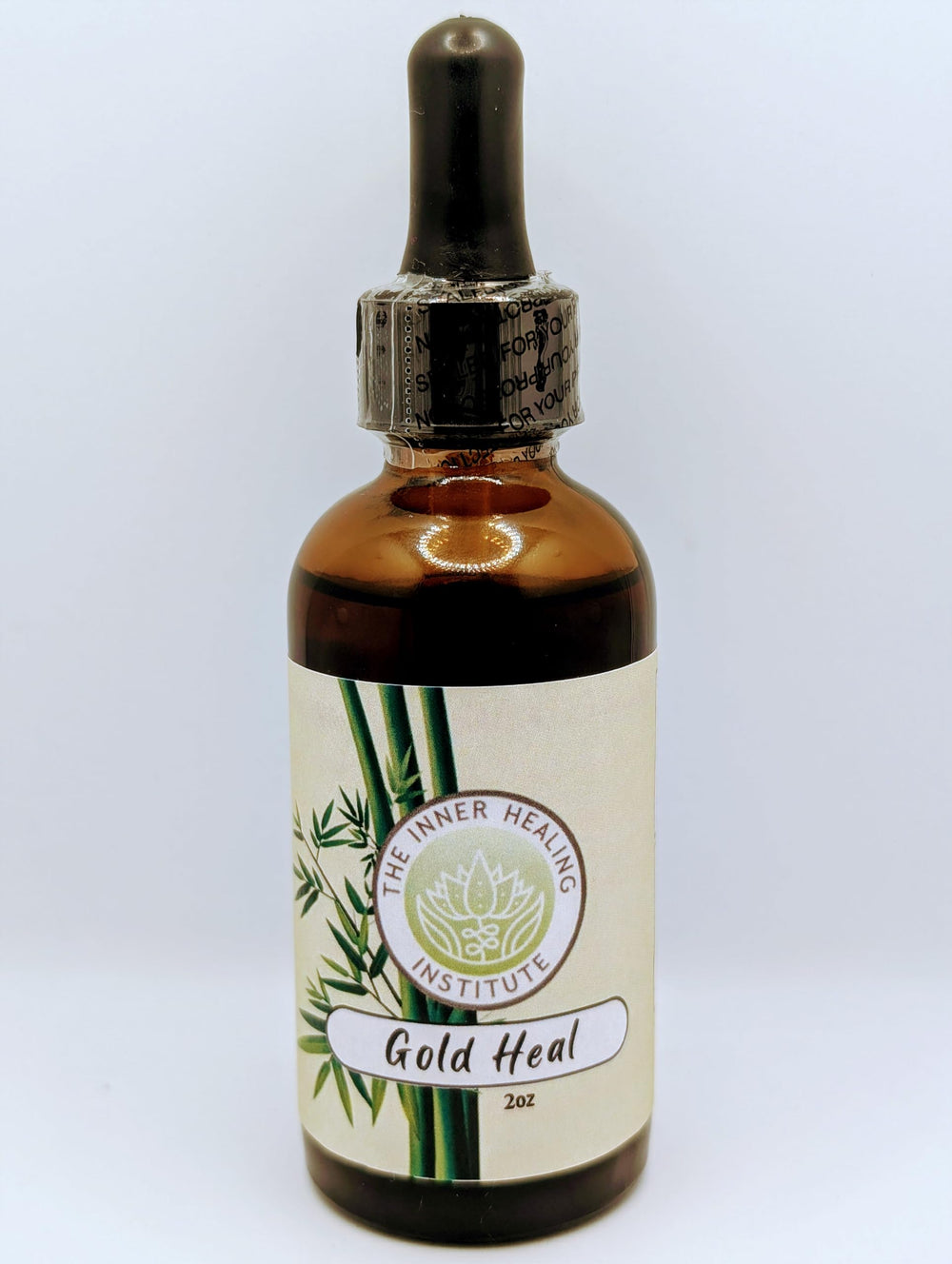 The Inner Healing Institute Gold Heal bottle with dropper for easy daily dosing.