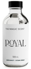 The Magic Scent Royal Hotel Diffuser Oil bottle on a tray for refined room ambiance.