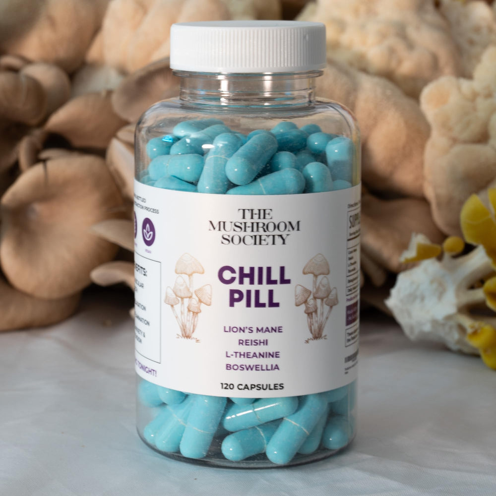 The Mushroom Society Chill Pill bottle on a nightstand suggests unwinding after a long day.