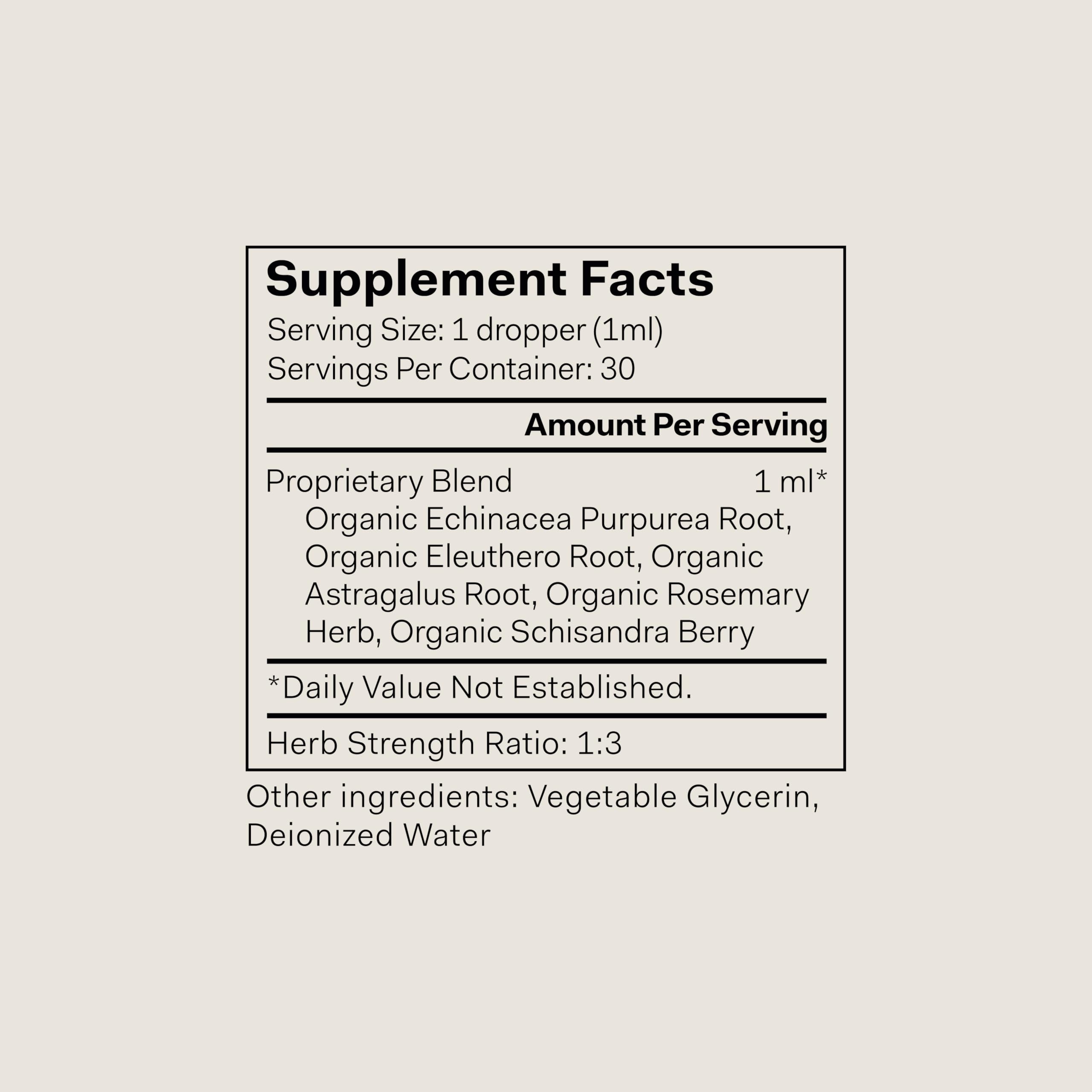 The Nue Co Defense Drops bottle side label shows vegan, alcohol-free formulation for mindful living.