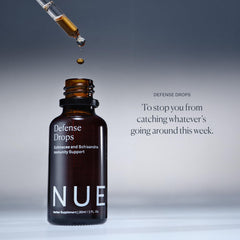 The Nue Co Defense Drops schisandra berry close-up implies resilience through daily stress.