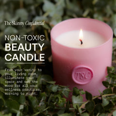 The Skinny Confidential candle wick close-up shows a clean, even burn with cotton wick.