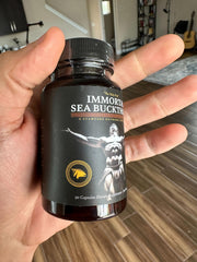 Immortal Sea Buckthorn Capsules within a daily wellness routine in a kitchen setting.