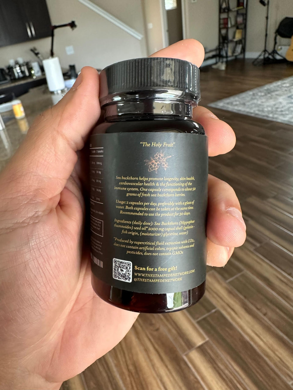Immortal Sea Buckthorn Capsules beside a glass suggest immune support.