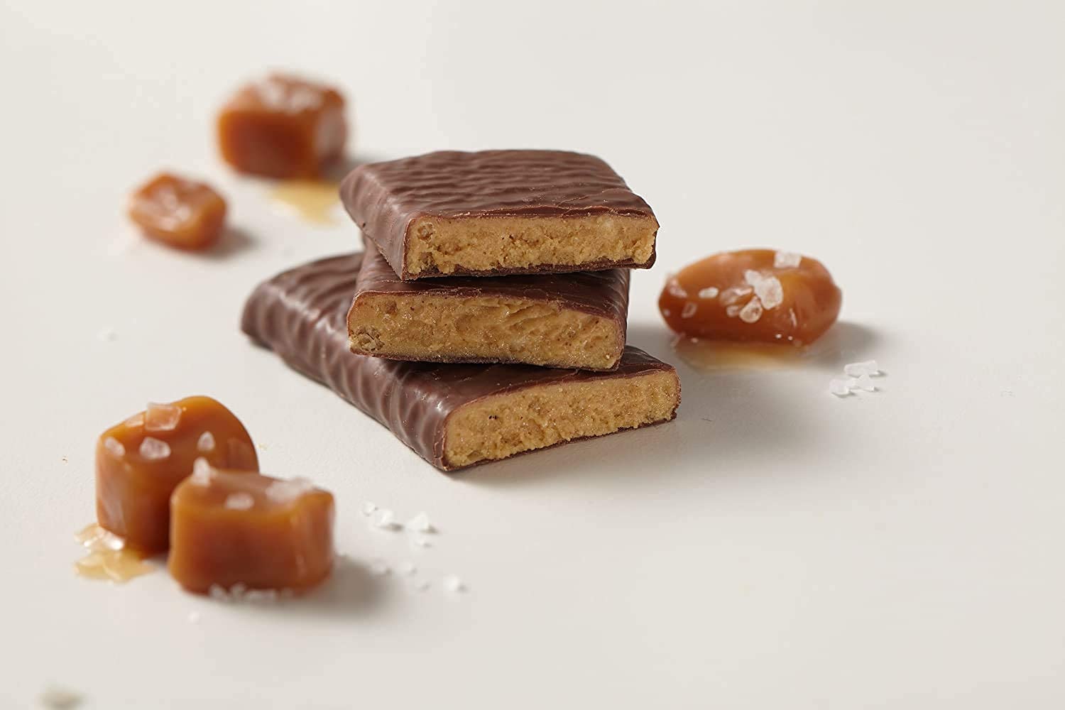 thinkThin Salted Caramel bar on desk ready for a quick protein snack