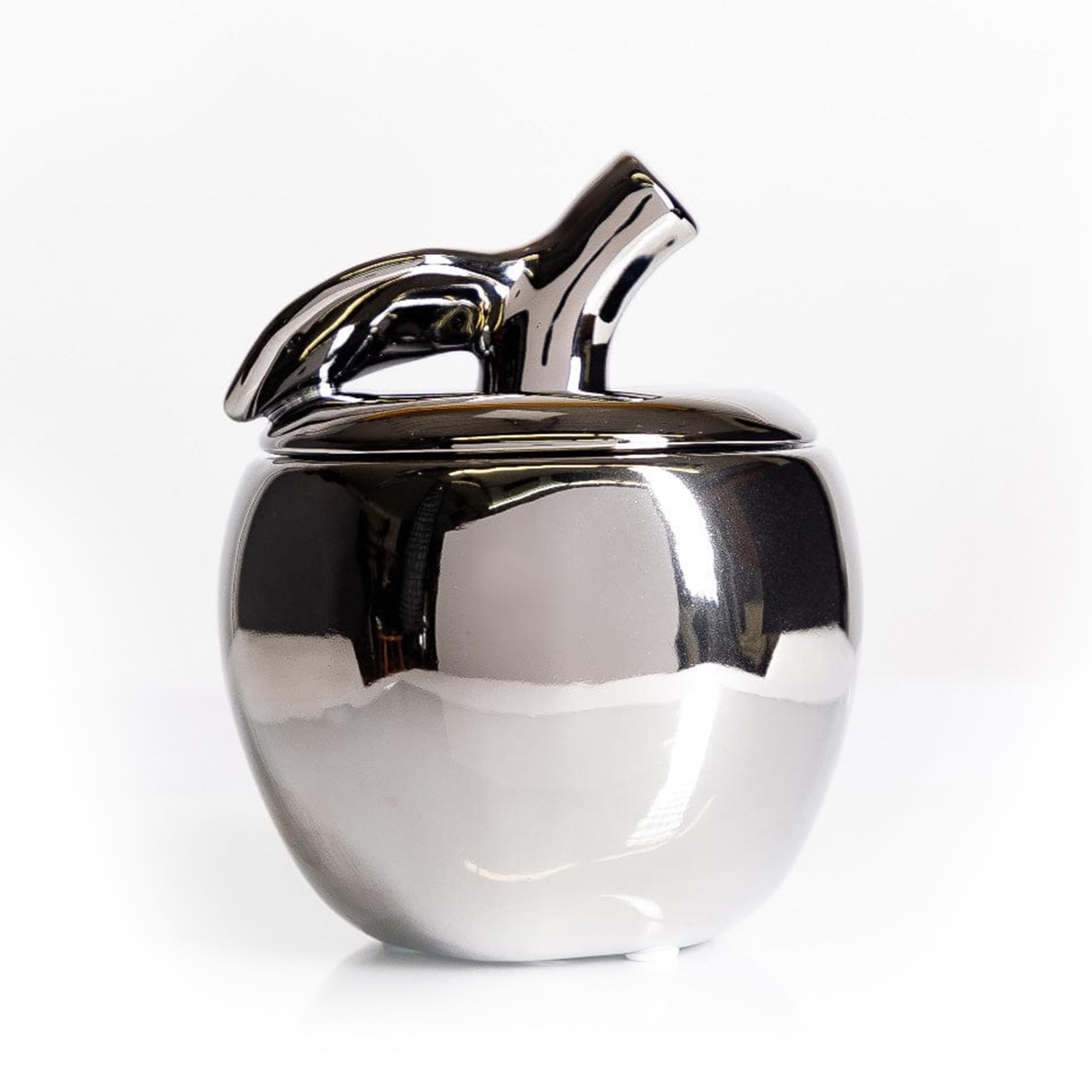 Thompson Ferrier apple-shaped ceramic jar adds an elegant autumn centerpiece.