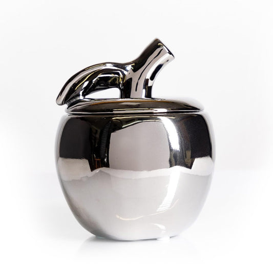 Thompson Ferrier apple-shaped ceramic jar adds an elegant autumn centerpiece.