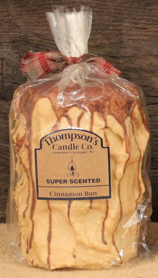 Thompson's Candle Co 44oz cinnamon bun pillar candle creates cozy ambience for large rooms.