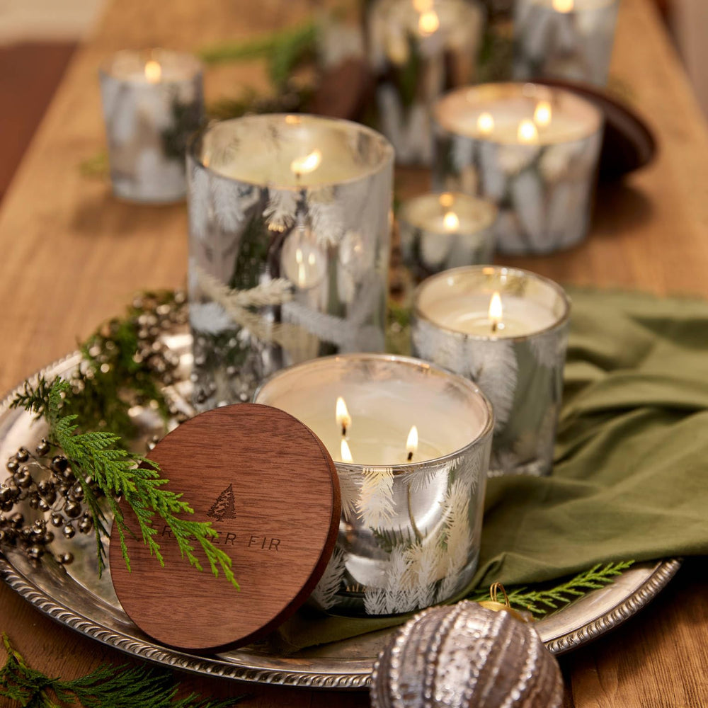 Thymes Frasier Fir candle evokes cedarwood and sandalwood notes for warmth