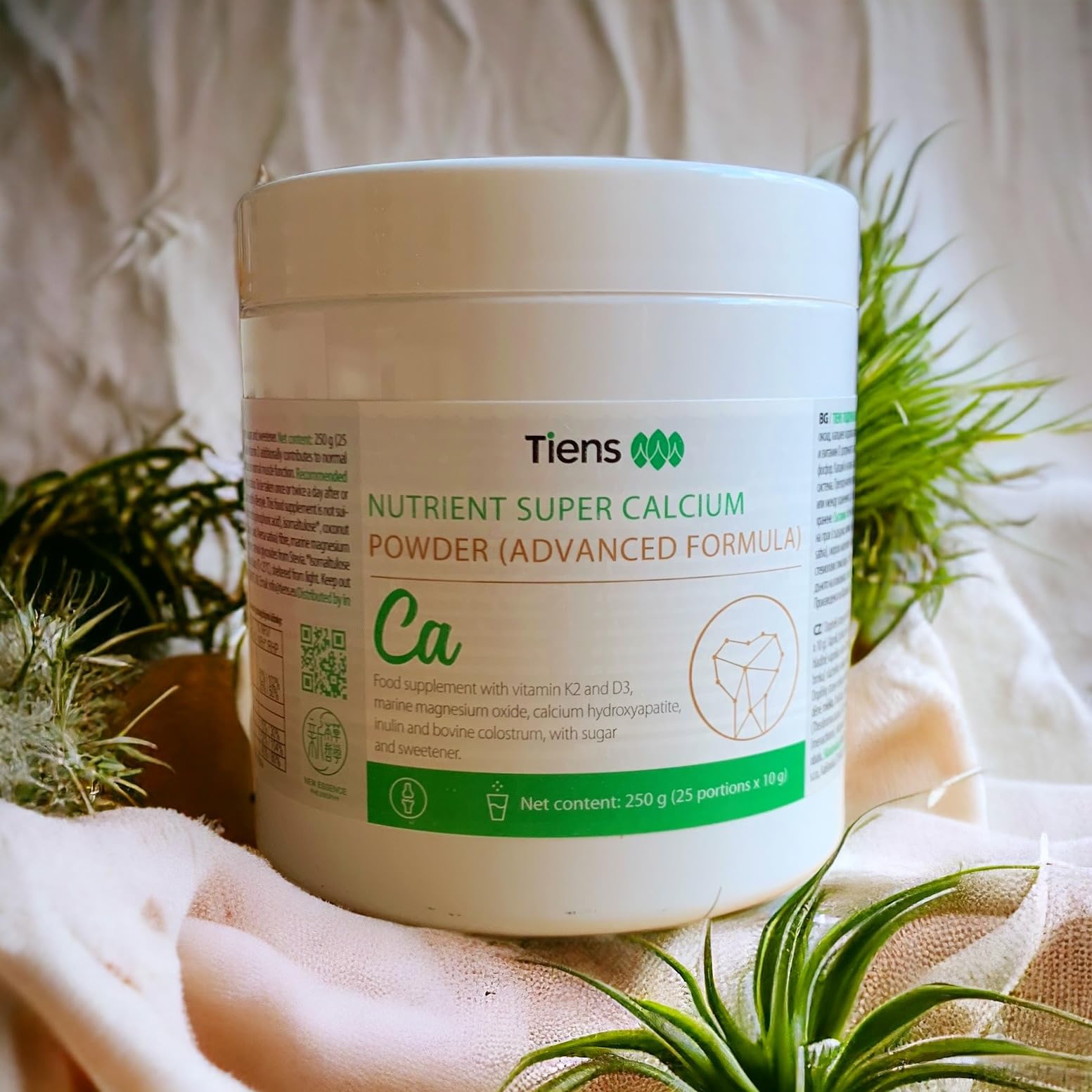 TIENS Nutrient Super Calcium Powder serving scoop next to powder for easy daily intake
