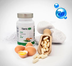 Tiens Zinc capsules with water for easy daily intake.