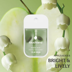 Touchland Blossom Velvet Peach bottle; delicate scent with skin-friendly hydration.