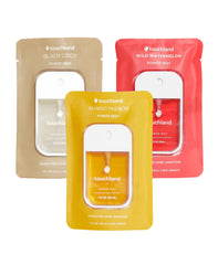 Touchland Mango Passion sanitizer spray bottle close-up, offering refreshing on-the-go hydration.