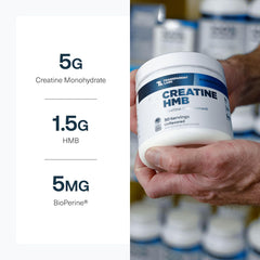 Transparent Labs Creatine HMB bottle beside measuring cup for easy dosing.