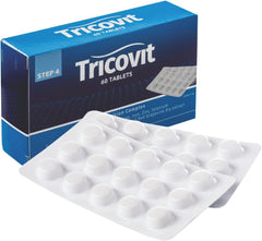 Tricovit hair growth supplement bottle on kitchen counter for healthy hair support.
