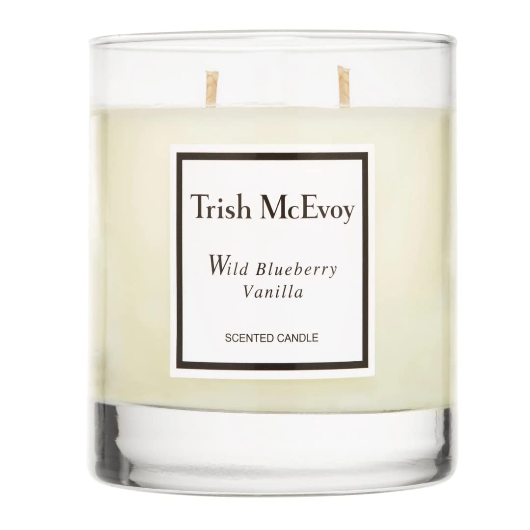 Trish McEvoy Wild Blueberry Vanilla candle in glass vessel for warm ambient fragrance.