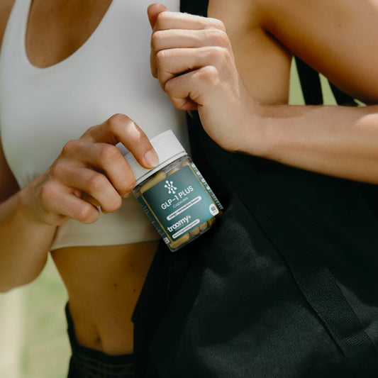 Pouring Troomy GLP-1 Plus capsules for easy daily use.