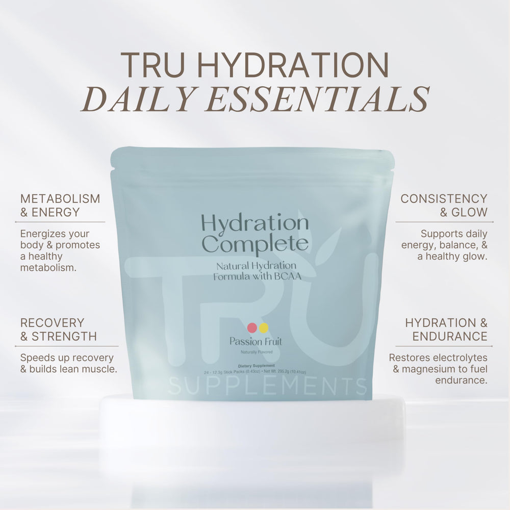 TRU Supplements Hydration Complete powder being poured into a glass for workouts.