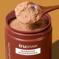 TruBrain Morning Mushrooms being poured into a cup for steady morning energy and clarity.
