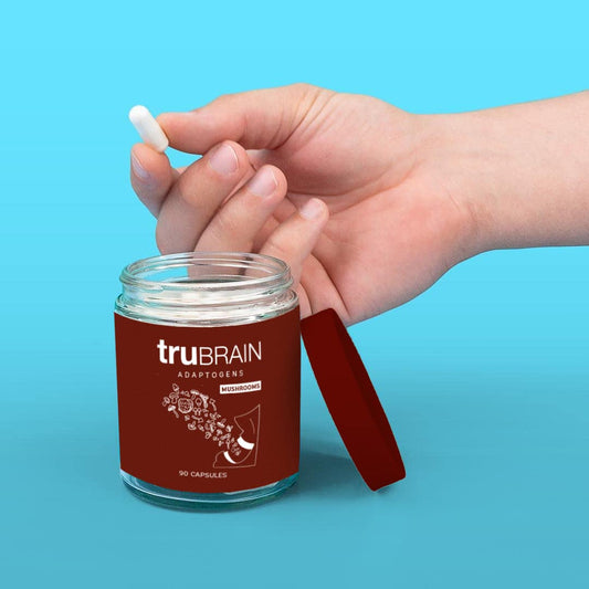 TruBrain nootropic capsules in hand suggest on-the-go mental clarity.