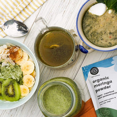 True Moringa moringa powder blended into smoothie for a nutritious start.