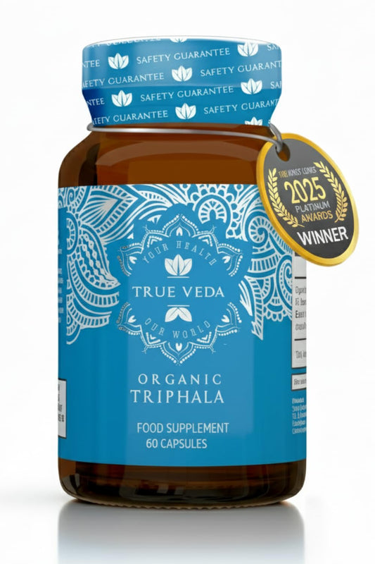 True Veda Triphala capsules in a bottle, organic formulation for gentle digestion.