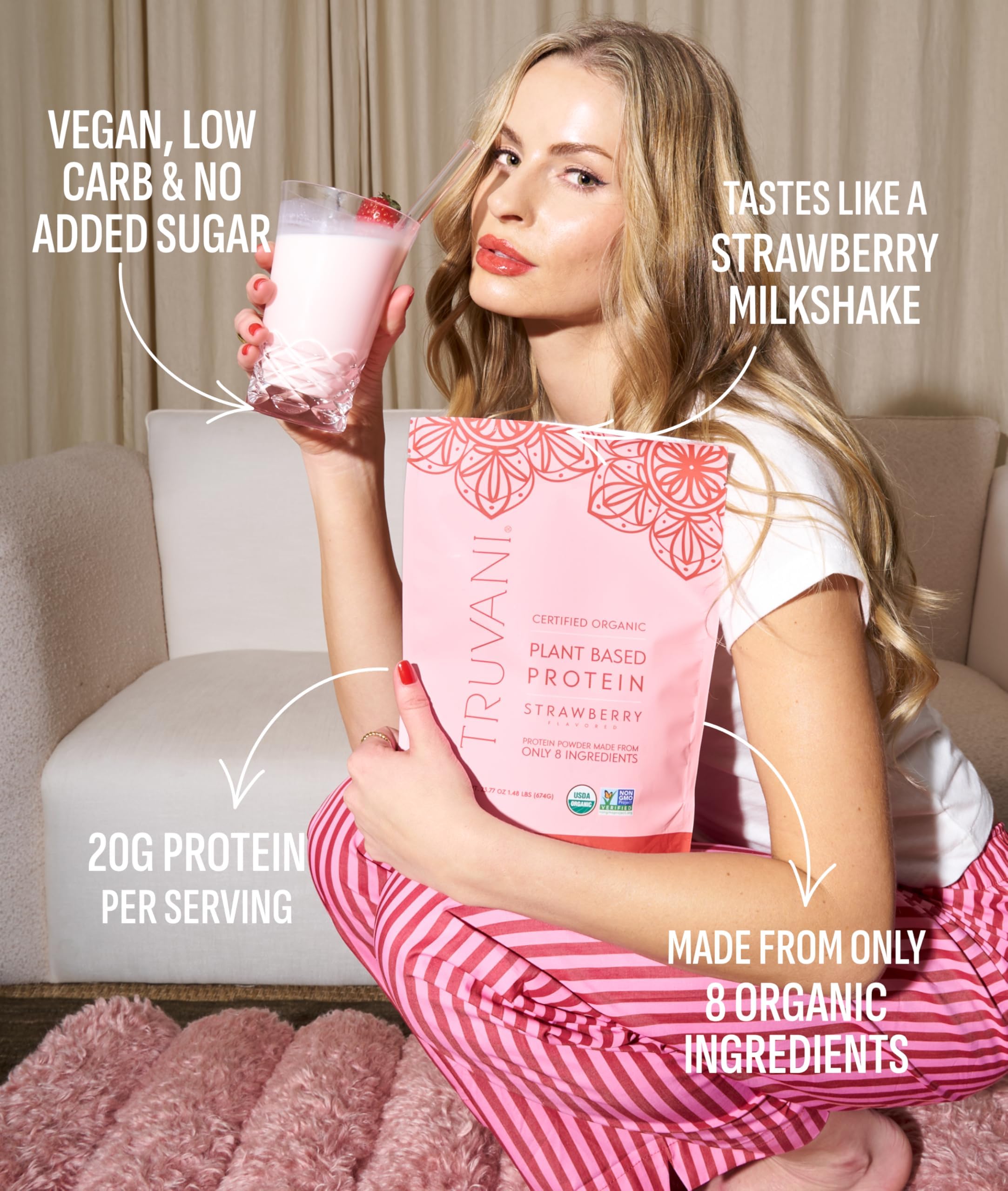 Truvani pea protein shake poured into glass with strawberry flavor.