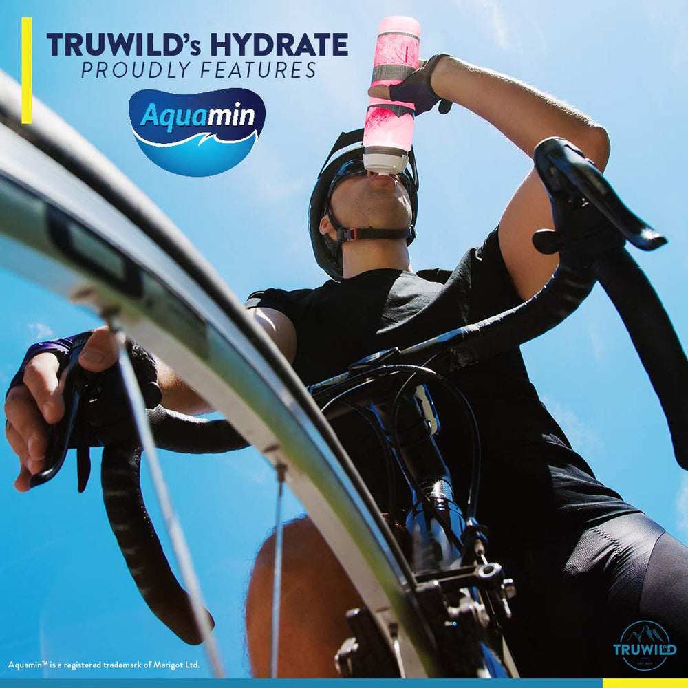 Passionfruit Guava TruWild Hydrate packet beside a glass