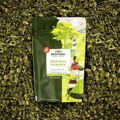 Two Brothers India Farms Moringa powder closeup reveals vibrant green texture