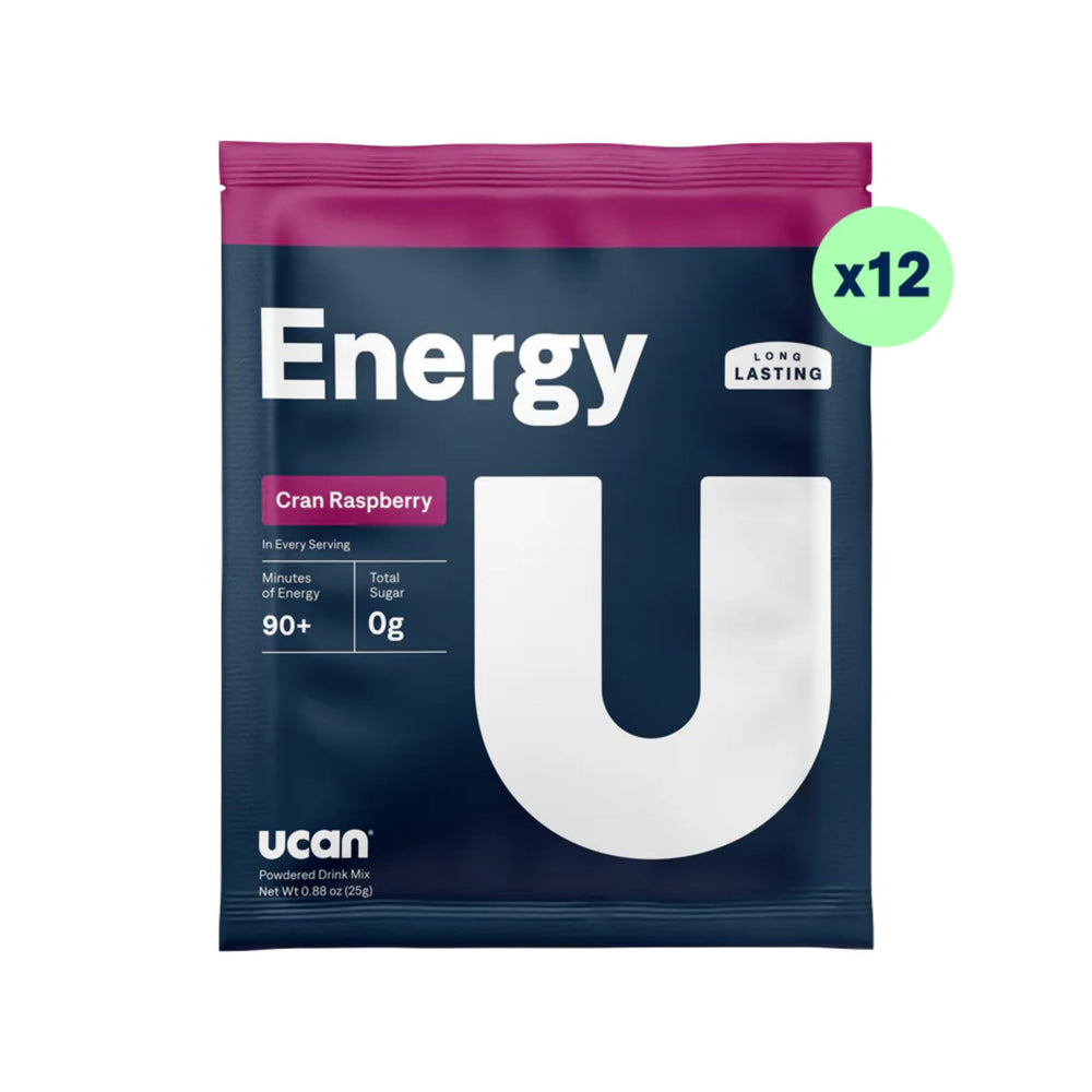 UCAN Energy Powder Cran-Raz dissolved in glass highlights clean, sugar-free hydration for workouts.