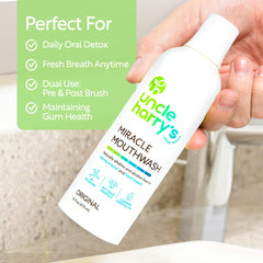 Pouring Uncle Harry's Miracle Mouthwash for a quick gargle