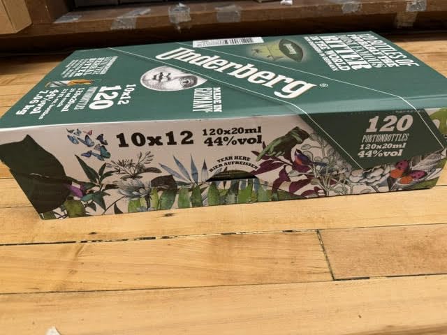 Underberg single-portion bottles wrapped in straw-paper for travel-ready use