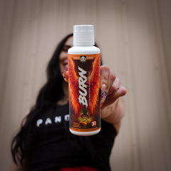 Thermogenesis concept illustrated by bottle against gym backdrop.