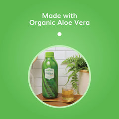 Pouring Univera Aloe Select Mango for a daily digestive routine.