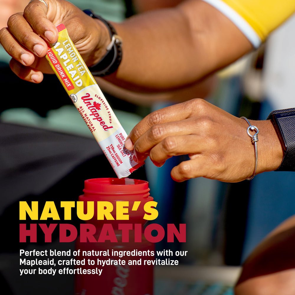 Untapped Lemon Tea Mapleaid being poured into water for refreshing hydration on the move.