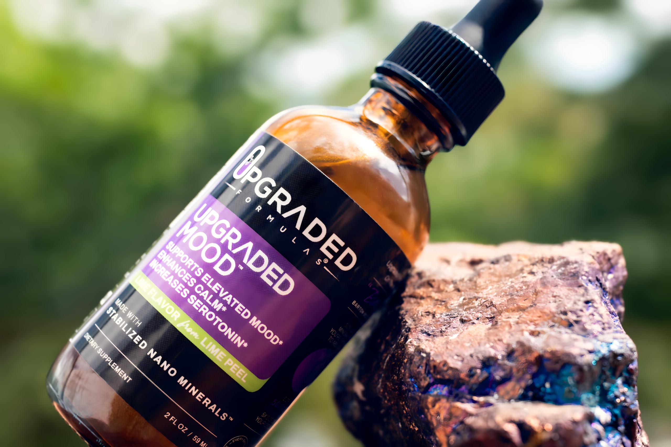 Upgraded Formulas Mood glass beside bottle for mindful moments.