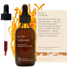 UPHORIC URTH Cordyceps double-extracted bottle on wood supports daily energy potential.