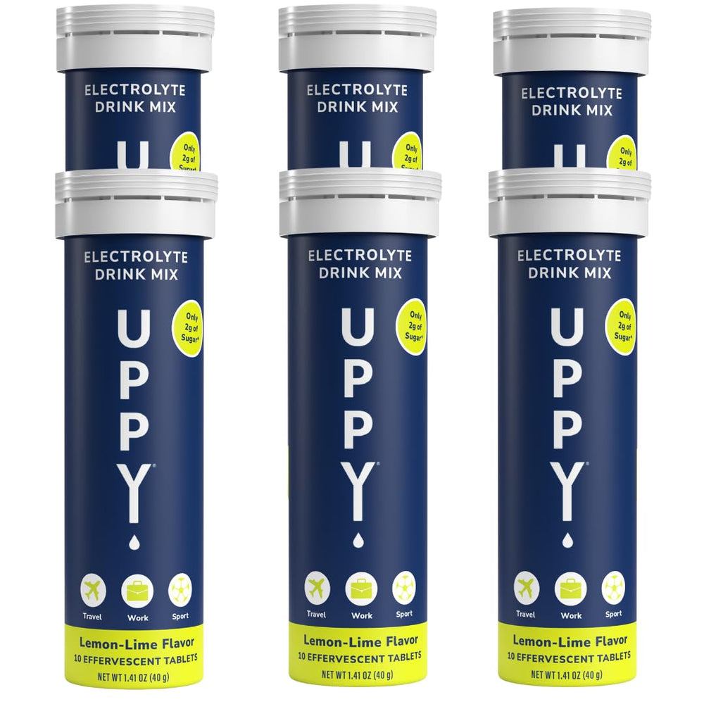 Uppy! lemon-lime tablets dissolving in water for rapid hydration on the go.