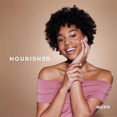 Upsa Nourished Collagen with glass of water ready to take.