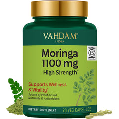 VAHDAM Moringa capsules bottle close-up highlighting 1100 mg strength for daily wellness.