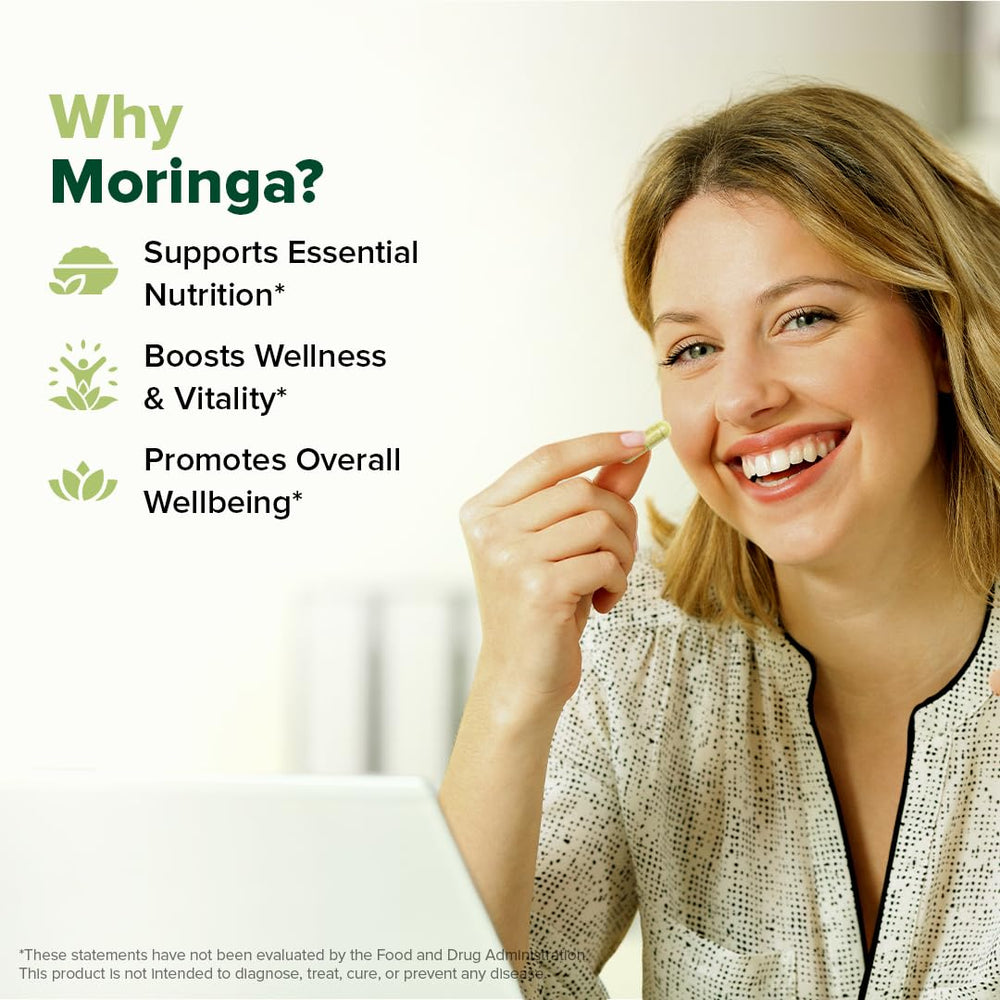 VAHDAM Moringa capsules outer packaging on wooden surface.